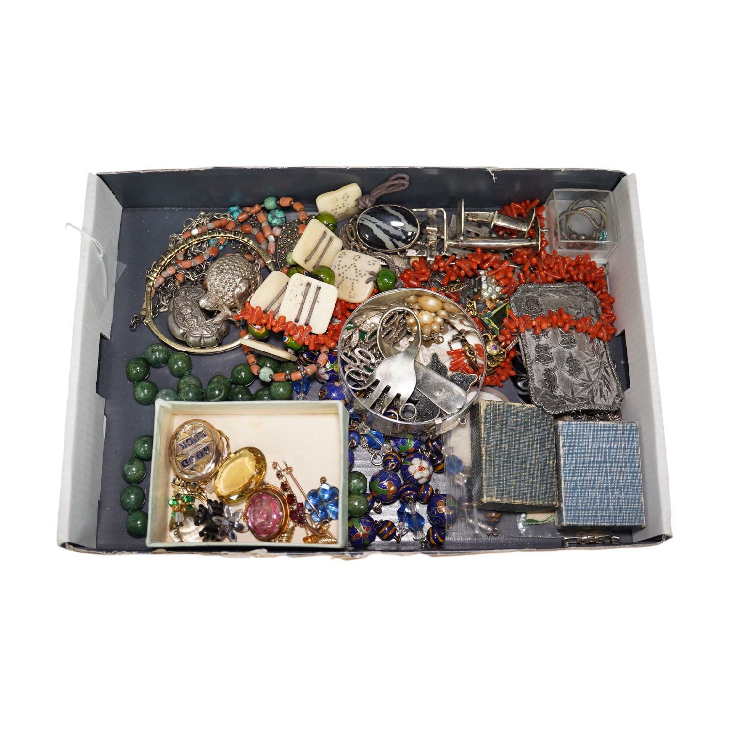 A quantity of assorted Victorian and later jewellery, including a 'Good Luck' oval locket, 9ct and garnet cluster brooch, a coral branch necklace, sterling bangle, part of a Chinese white metal buckle, Italian glass bead